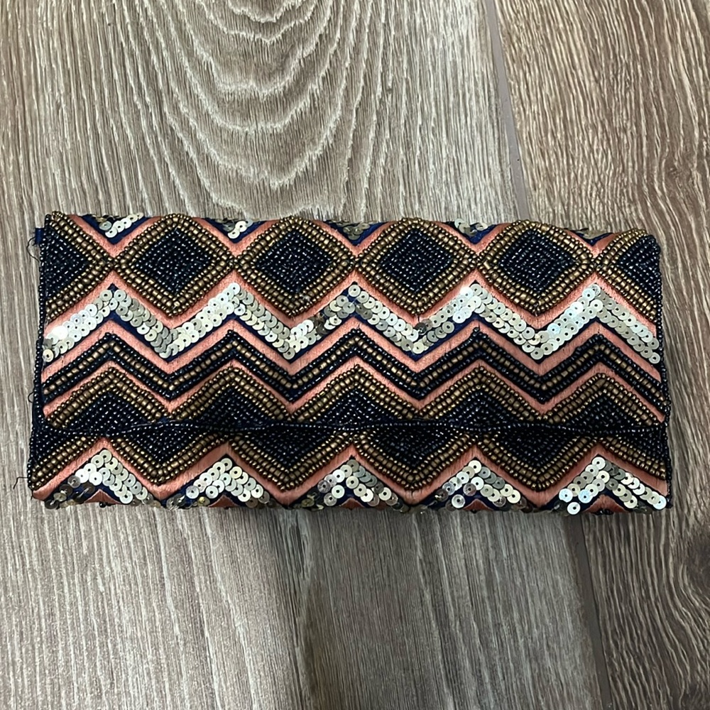 Barely used clutch. Great for a night out or fancy event.